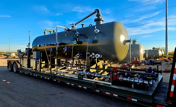 Skid-mounted process equipment with tanks, pipework, and service access